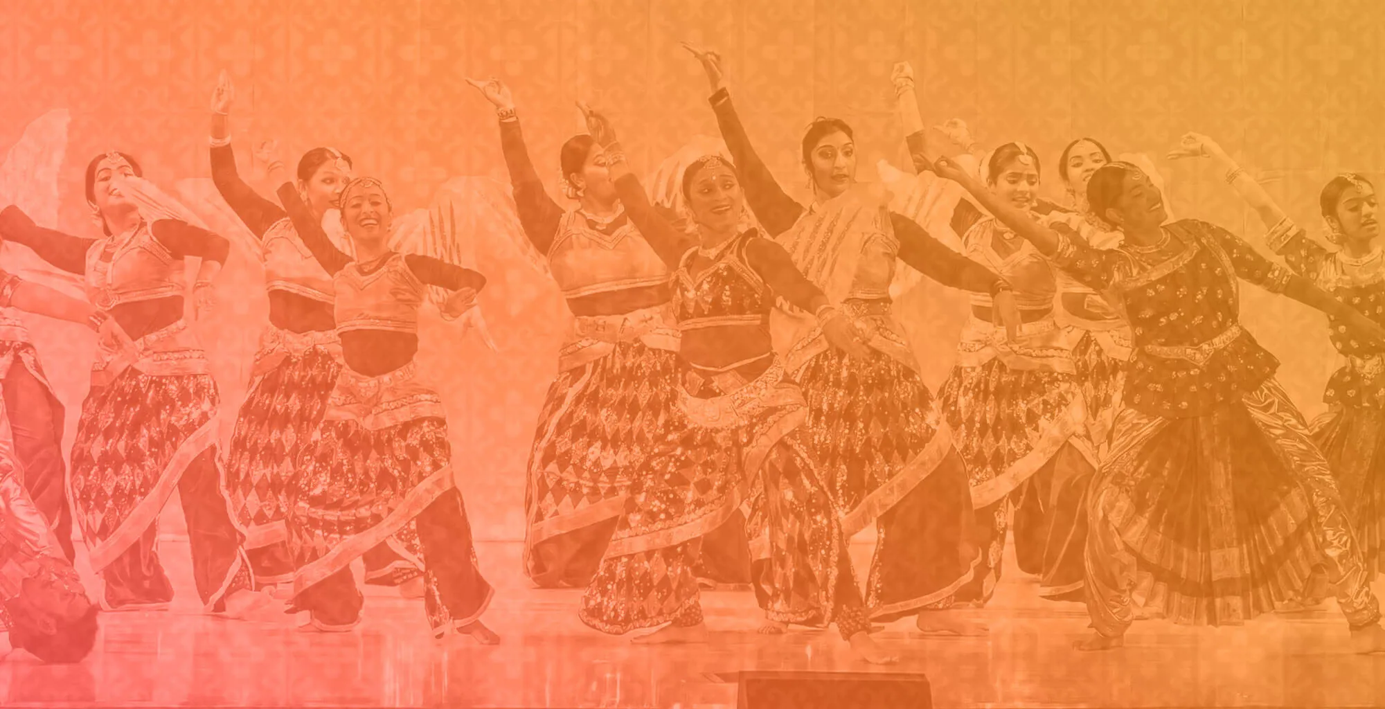Adult dancers rehearsing a Bollywood routine