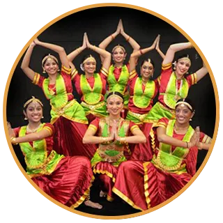 Shingari performing a Bharatanatyam group pose with dancers