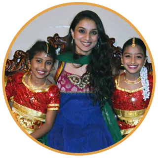 Shingari with two young students in performance costume